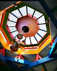 Low angle view of clock on ceiling in building