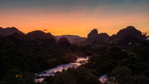 Scenic view of mountains against sky during sunset