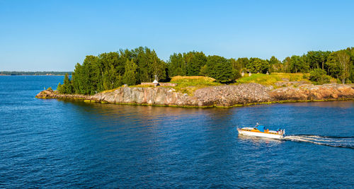 Scenic view of sea against clear blue sky