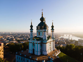 View of buildings in city against clear sky