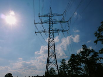 Low angle view of electricity pylon against sky