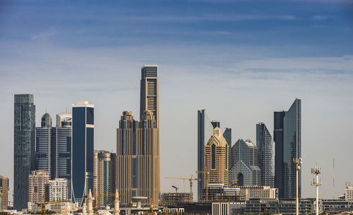 Skyscrapers in city against sky