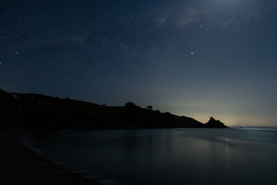 Scenic view of sea against sky at night