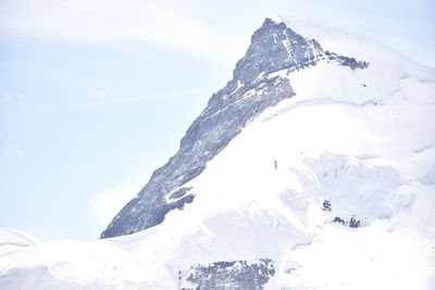 Snow covered mountains against sky