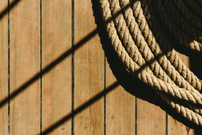 Shadow of rope on wood