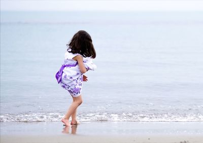 Rear view of woman on beach