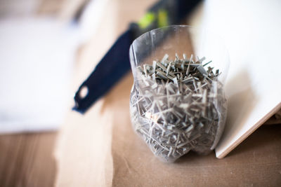 Close-up of metal in container on table