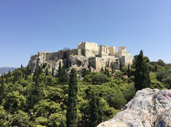 View of the parthenon on the athenian acropolis seen from the areopagus hill in athens, greece.