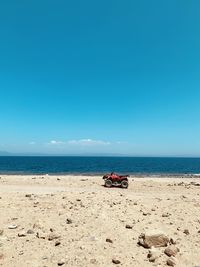 One red buggy quad at silent red sea beach