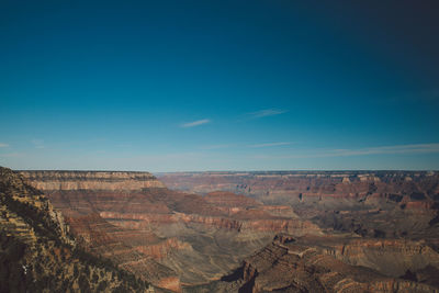 Idyllic view of cliffs against blue sky at grand canyon national park