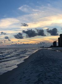 Scenic view of beach against sky during sunset