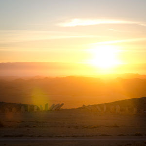 Scenic view of landscape against sky during sunset