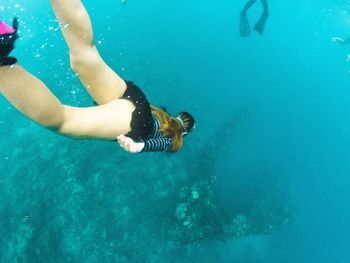 Woman swimming in sea