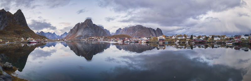 Panoramic view of buildings and mountains against sky