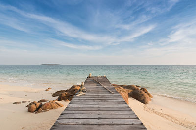 Pier over sea against sky