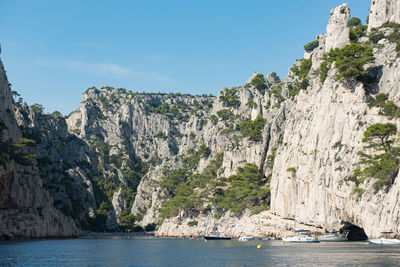 Scenic view of sea and mountain against sky