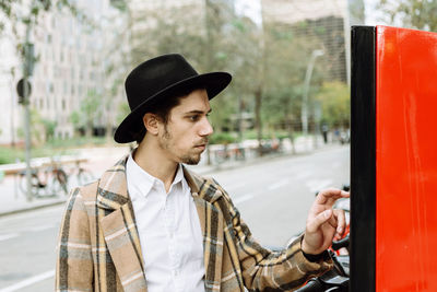 Portrait of young man in car