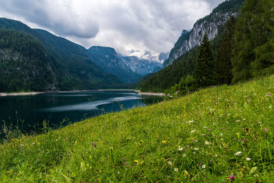 Scenic view of lake and mountains against sky