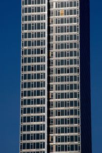 Low angle view of building against clear blue sky