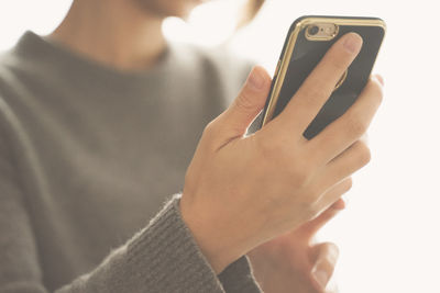 Close-up of hand using mobile phone