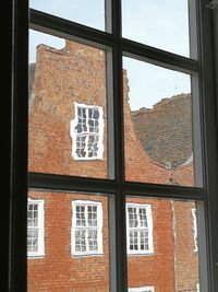 Buildings seen through glass window