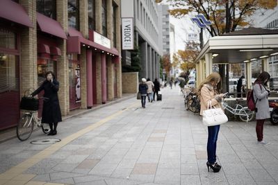 People walking on city street