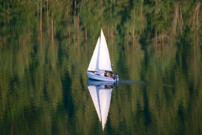 Boats sailing in lake