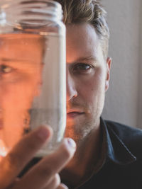 Close-up of man holding drink