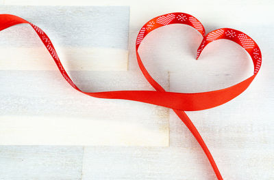 Directly above shot of heart shape made on white table