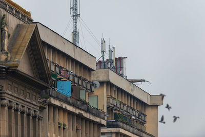 Low angle view of buildings against clear sky