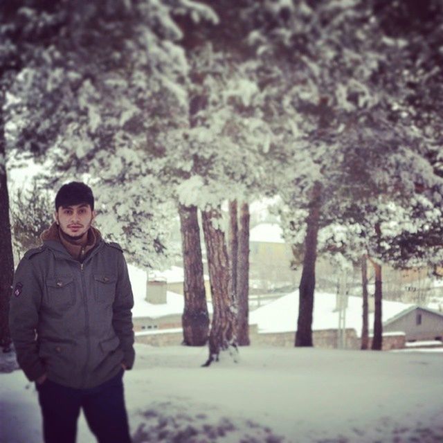 lifestyles, leisure activity, winter, snow, cold temperature, casual clothing, warm clothing, standing, tree, waist up, season, rear view, person, weather, focus on foreground, three quarter length, men, young men