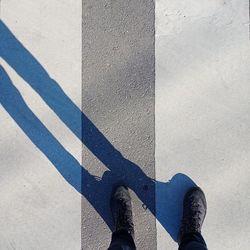 Low section of person standing on street