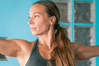 Close-up of woman exercising at home