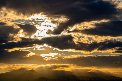 Low angle view of dramatic sky during sunset