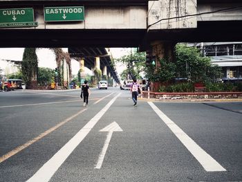 People walking on road in city