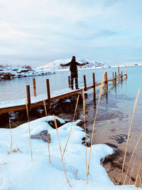 People landscape footbridge bridge alone lonely norway snow winter holiday travel spot sea water 