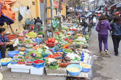 People at market stall