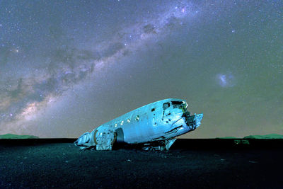 View of turtle in sea against sky at night