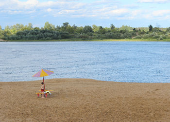 Scenic view of beach against sky