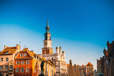 Low angle view of buildings against blue sky