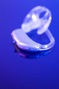 High angle view of illuminated lamp on blue background