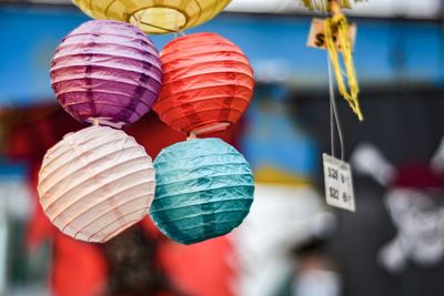 Close-up of multi colored lanterns for sale at market