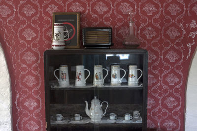 Close-up of clock on shelf at home