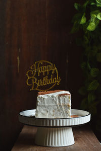 Close-up of simple birthday cake on table