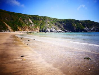 Scenic view of beach against sky