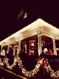 Low angle view of illuminated lights at night