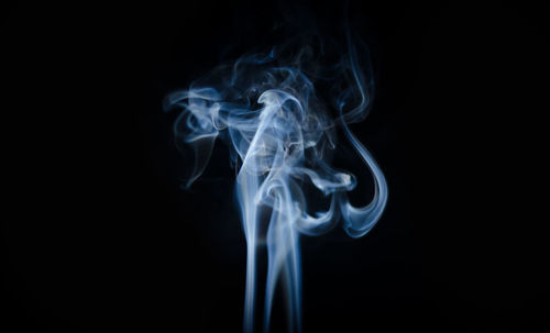 Close-up of smoke against black background