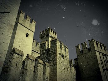 Low angle view of building against sky at night