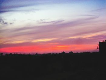 Silhouette of landscape against dramatic sky
