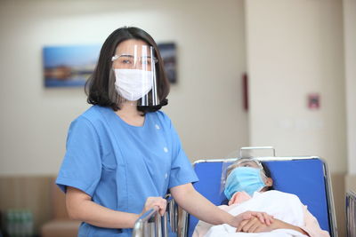 Woman standing in front of two people